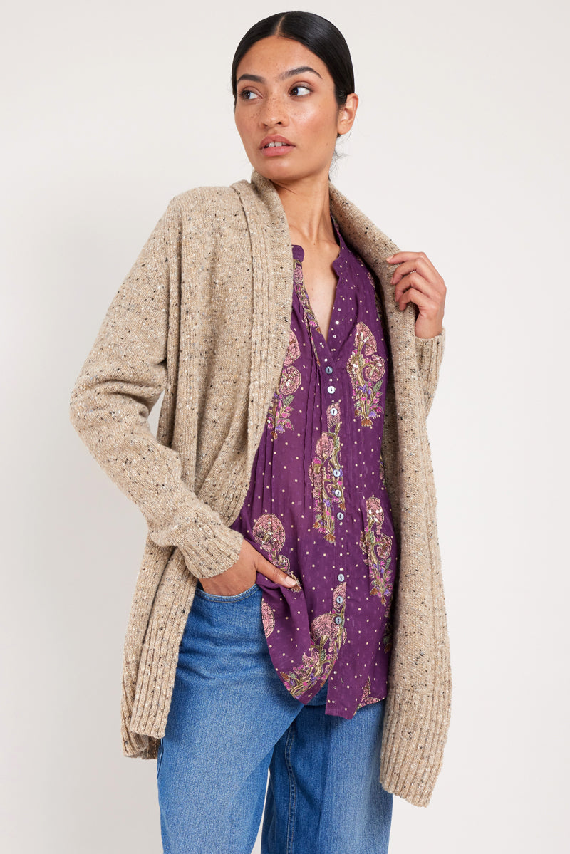 Model wears oat longline knit cardigan